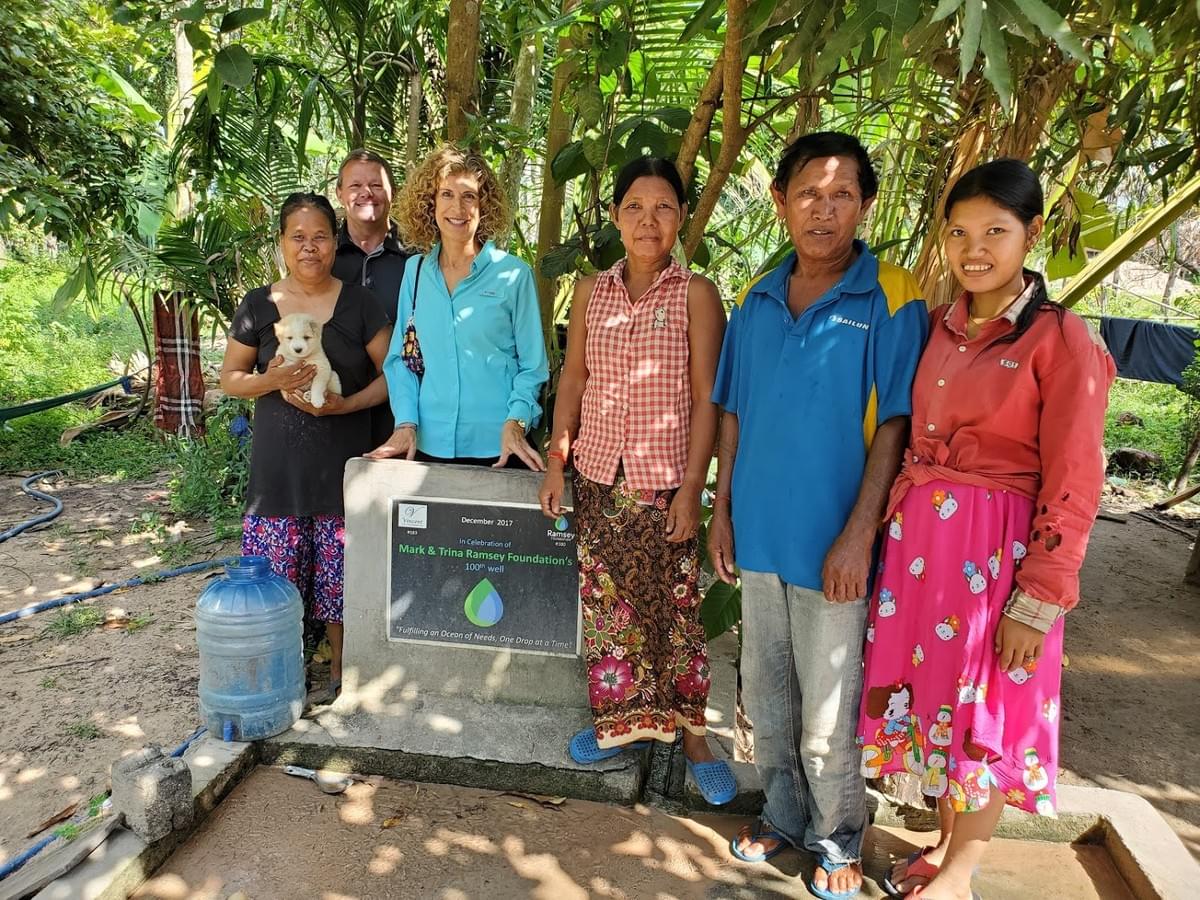 Mark & Trina with the Cambodian family that received Ramsey Foundation's 100th well