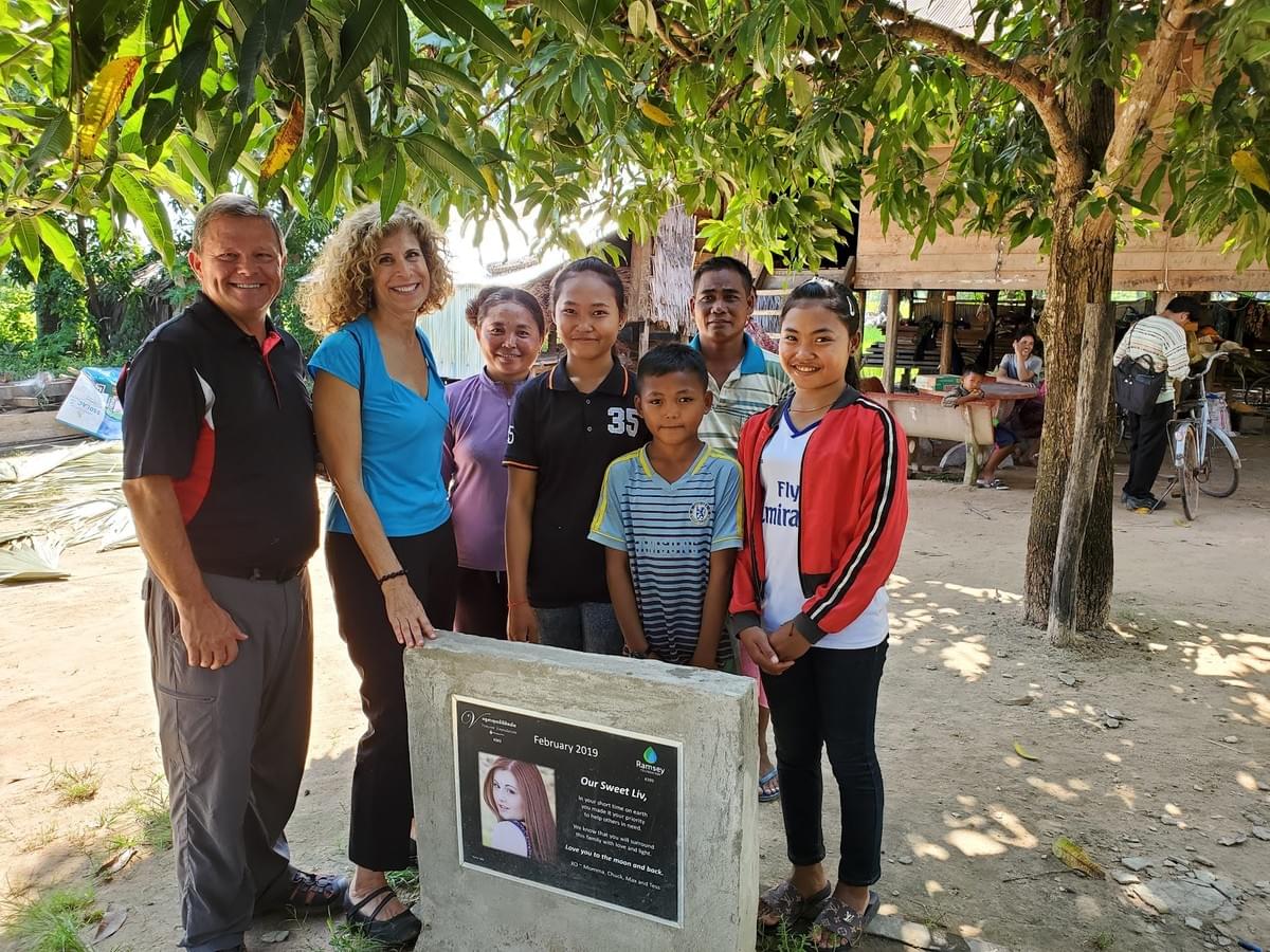 Mark & Trina with a Camobian family that received a water well dedicated in loving memory of Liv