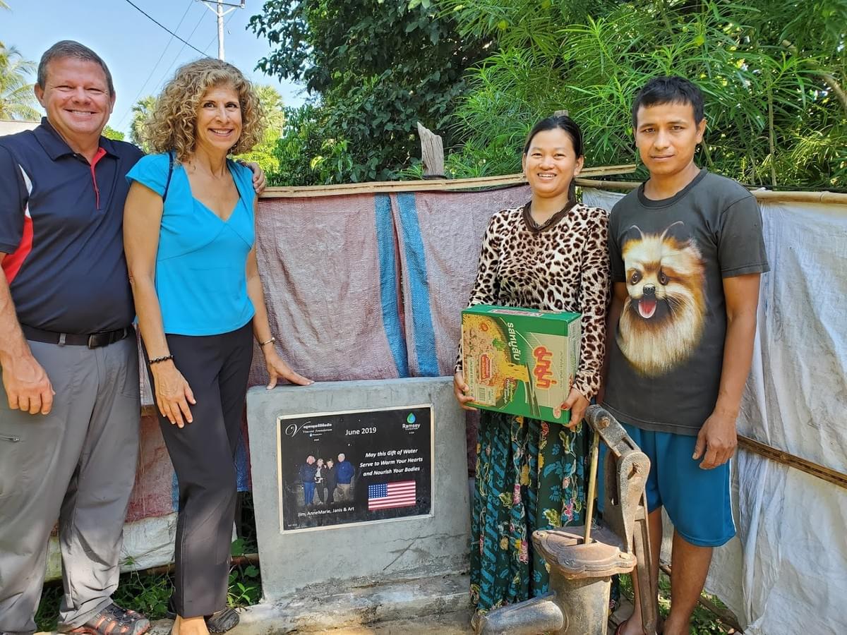Cambodian couple with their water well, donated through MTRF by Jim & AnneMarie Eastman in honor of their friendship with Art & Janis Carty