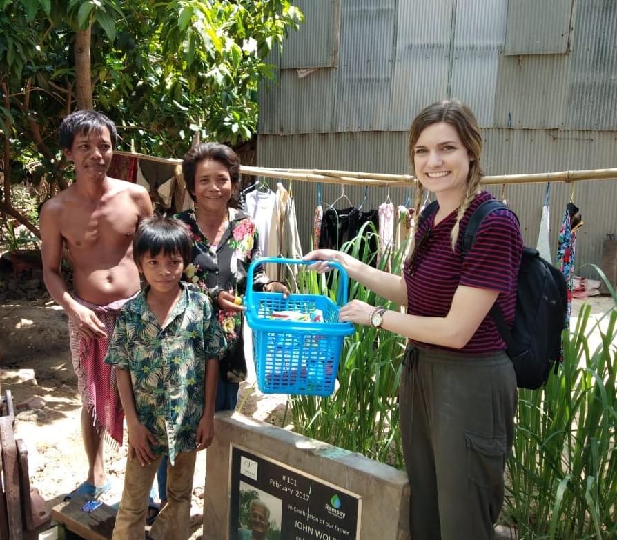Gifting the Cambodian family that received a water well dedicated to her grandfather, John Wolff.