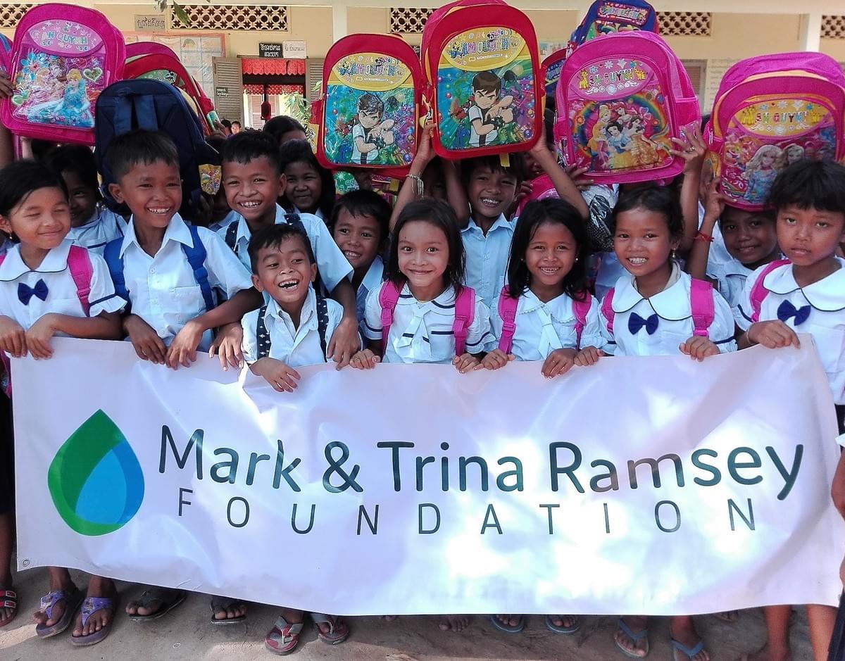 School Children celebrate the gift of being able to attend school in Cambodia, thanks to uniforms, backpacks and school supplies provided through supporters of MTRF