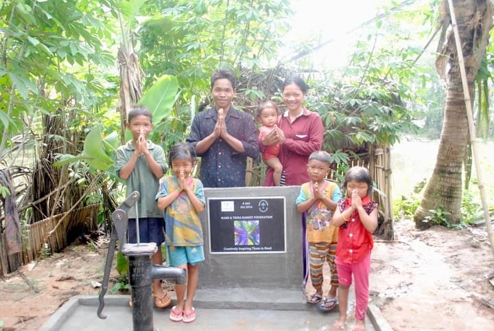 Cambodian family at their new water well
